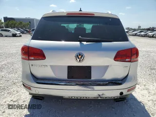 2014 Volkswagen Touareg Sport with VIN WVGEF9BP8ED005445, listed as a Copart auction lot 53694215 with 194,711 mi miles and Salvage Title. Bid and sale history available at DreamBid. Image 6.