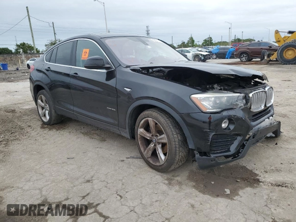 2015 BMW X4 xDrive28i with VIN 5UXXW3C51F0M88632, listed as a Copart auction lot 82401313 with 0 mi miles. Bid and sale history available at carsss.com. Image 4.