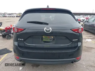 2020 Mazda CX-5 Grand Touring with VIN JM3KFADM8L0811910, listed as a IAAI auction lot 41446214 with 57,849 mi miles. Bid and sale history available at carsss.com. Image 17.