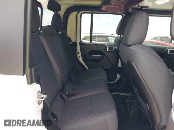 2024 Jeep Gladiator Rubicon z VIN 1C6JJTBG5RL110865, wystawiony jako IAAI lot #42104829 z przebiegiem 6 815 mil mil oraz . Historia ofert i sprzedaży dostępna na DreamBid. Obrazek 8.