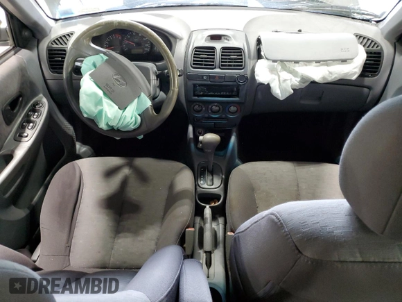 2005 Hyundai Accent GLS with VIN KMHCG45C95U632932, listed as a Copart auction lot 69448004 with 0 mi miles and Salvage Title. Bid and sale history available at carsss.com. Image 8.