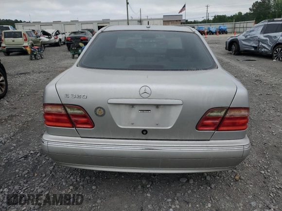 2000 Mercedes-Benz E 320 with VIN WDBJF65J1YB099417, listed as a Copart auction lot 54656915 with 130,387 mi miles and Salvage Title. Bid and sale history available at DreamBid. Image 6.