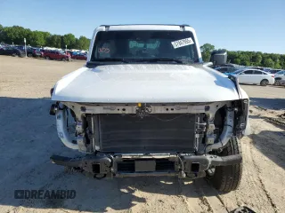 2023 Ford Bronco z VIN 1FMEE5BP7PLC16799, wystawiony jako Copart lot #57847955 z przebiegiem 11 980 mil mil oraz Czysty tytuł • Clean title. Historia ofert i sprzedaży dostępna na DreamBid. Obrazek 5.
