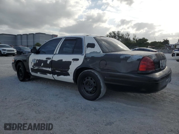 2005 Ford Police Interceptor with VIN 2FAFP71W35X128684, listed as a Copart auction lot 54002165 with 144,766 mi miles and Clean title. Bid and sale history available at DreamBid. Image 2.