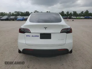 2023 Tesla Model Y Long Range z VIN 7SAYGDEE0PF802511, wystawiony jako Copart lot #54959415 z przebiegiem 12 902 mil mil oraz Szkoda całkowita • Salvage title. Historia ofert i sprzedaży dostępna na DreamBid. Obrazek 6.