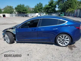 2019 Tesla Model 3 Mid Range with VIN 5YJ3E1EA6KF402308, listed as a IAAI auction lot 40077902 with 89,794 mi miles and . Bid and sale history available at carsss.com. Image 14.