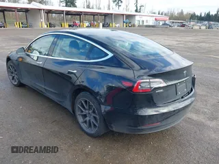 2019 Tesla Model 3 Mid Range with VIN 5YJ3E1EA4KF305611, listed as a IAAI auction lot 41916738 with 59,101 mi miles and . Bid and sale history available at carsss.com. Image 3.