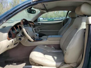 2002 Jaguar XK with VIN SAJDA42C22NA23724, listed as a Copart auction lot 53521005 with 61,468 mi miles and Salvage Title. Bid and sale history available at DreamBid. Image 7.
