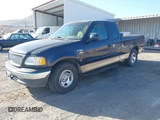 1999 Ford F-150 XL with VIN 1FTRX17L5XKB39130, listed as a IAAI auction lot 42041520 with Not Provided miles. Bid and sale history available at carsss.com. Image 2.