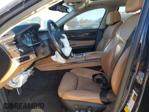 2011 BMW 7 Series 740i with VIN WBAKA4C51BC612629, listed as a Copart auction lot 77372234 with 164,471 mi miles and Salvage Title. Bid and sale history available at carsss.com. Image 7.