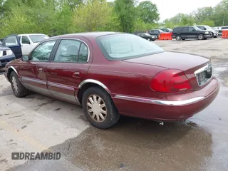 2000 Lincoln Continental with VIN 1LNHM97V5YY845447, listed as a IAAI auction lot 42077417 with 83,655 mi miles. Bid and sale history available at carsss.com. Image 3.
