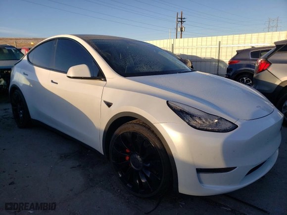 2021 Tesla Model Y Performance with VIN 5YJYGDEF4MF073074, listed as a Copart auction lot 84508354 with 76,398 mi miles and Salvage Title. Bid and sale history available at carsss.com. Image 4.