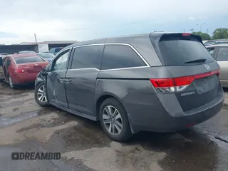 2016 Honda Odyssey Touring Elite with VIN 5FNRL5H97GB010048, listed as a IAAI auction lot 40212711 with 119,009 mi miles and . Bid and sale history available at DreamBid. Image 3.