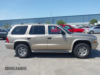 2003 Dodge Durango SLT z VIN 1D4HS48N43F517701, wystawiony jako IAAI lot #42277135 z przebiegiem 135 521 mil mil oraz . Historia ofert i sprzedaży dostępna na DreamBid. Obrazek 13.