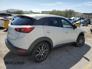 2018 Mazda CX-3 Touring z VIN JM1DKFC74J0312864, wystawiony jako Copart lot #55862845 z przebiegiem 75 584 mil mil oraz Szkoda całkowita • Salvage title. Historia ofert i sprzedaży dostępna na DreamBid. Obrazek 3.