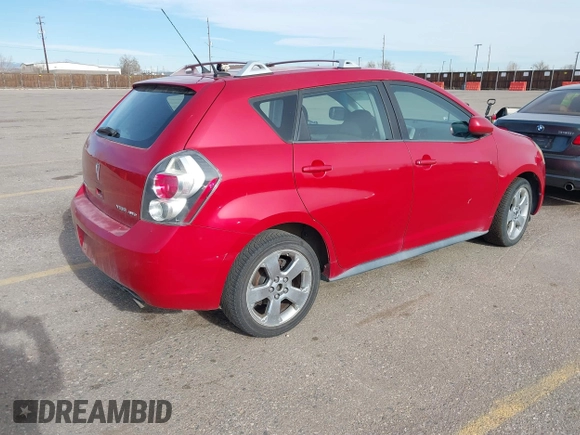 2009 Pontiac Vibe with VIN 5Y2SM67009Z401692, listed as a IAAI auction lot 41769199 with 143,904 mi miles. Bid and sale history available at carsss.com. Image 4.