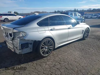 2015 BMW 4 Series 428i with VIN WBA4A5C58FG051293, listed as a IAAI auction lot 41255541 with 60,737 mi miles and . Bid and sale history available at DreamBid. Image 4.