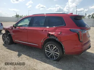 2024 Cadillac XT6 AWD Sport z VIN 1GYKPHRS0RZ724524, wystawiony jako Copart lot #61333185 z przebiegiem 12 799 mil mil oraz Nie do naprawy • Non repairable. Historia ofert i sprzedaży dostępna na DreamBid. Obrazek 2.
