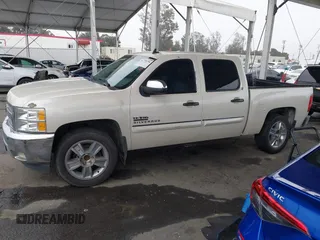 2013 Chevrolet Silverado 1500 LT with VIN 3GCPCSE06DG187949, listed as a IAAI auction lot 41799296 with 169,919 mi miles and . Bid and sale history available at DreamBid. Image 14.