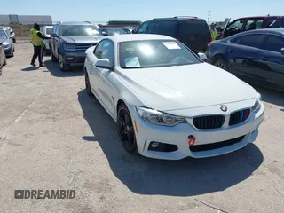 2015 BMW 4 Series 428i z VIN WBA3V7C52FP771779, wystawiony jako IAAI lot #41953647 z przebiegiem 66 003 mil mil oraz . Historia ofert i sprzedaży dostępna na DreamBid. Obrazek 1.