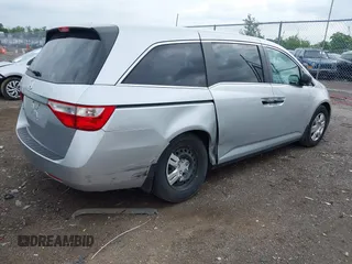 2011 Honda Odyssey LX with VIN 5FNRL5H25BB040287, listed as a IAAI auction lot 42456679 with 129,176 mi miles and . Bid and sale history available at DreamBid. Image 4.