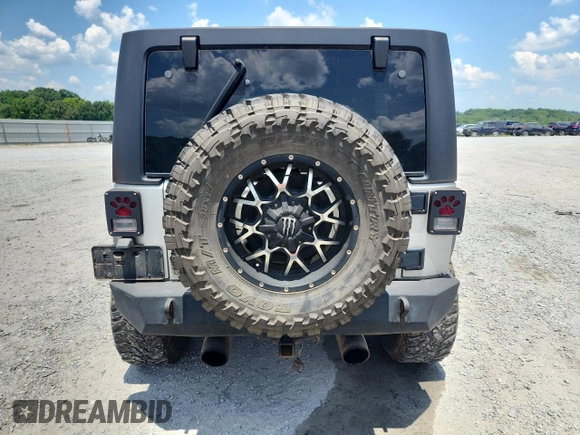 2007 Jeep Wrangler Unlimited Sahara с VIN 1J4GA59167L183198, выставлен на аукционе Copart как лот 62135995 с пробегом Не указан миль и Списание • Salvage title. История ставок и продаж доступна на DreamBid. Изображение 6.