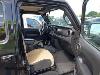 2023 Jeep Wrangler Sport S with VIN 1C4HJXDN6PW599895, listed as a IAAI auction lot 42242107 with 53,980 mi miles and . Bid and sale history available at DreamBid. Image 5.