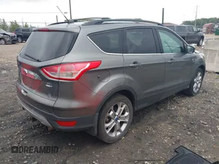 2013 Ford Escape SEL with VIN 1FMCU9HX4DUC75565, listed as a IAAI auction lot 42574351 with 180,876 mi miles and . Bid and sale history available at DreamBid. Image 4.