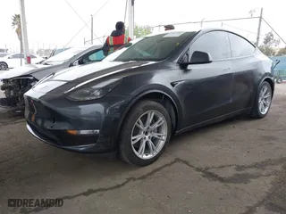 2024 Tesla Model Y with VIN 7SAYGDED8RF039678, listed as a IAAI auction lot 42057006 with 32,770 mi miles. Bid and sale history available at carsss.com. Image 21.