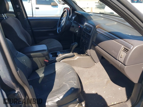 2001 Jeep Grand Cherokee Laredo with VIN 1J4GW48S31C550460, listed as a IAAI auction lot 42769410 with 261,640 mi miles and . Bid and sale history available at DreamBid. Image 5.