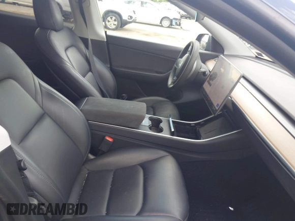 2021 Tesla Model Y Long Range z VIN 5YJYGDEE6MF070068, wystawiony jako IAAI lot #42224634 z przebiegiem 33 850 mil mil oraz . Historia ofert i sprzedaży dostępna na DreamBid. Obrazek 5.