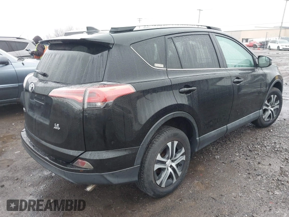 2018 Toyota RAV4 LE with VIN 2T3BFREV2JW788700, listed as a IAAI auction lot 41986212 with 87,704 mi miles. Bid and sale history available at carsss.com. Image 4.