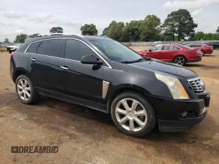 2014 Cadillac SRX Performance Collection z VIN 3GYFNCE38ES525883, wystawiony jako Copart lot #55085505 z przebiegiem 160 609 mil mil oraz Szkoda całkowita • Salvage title. Historia ofert i sprzedaży dostępna na DreamBid. Obrazek 4.