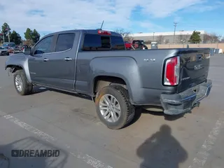 2018 GMC Canyon 4WD SLT with VIN 1GTP6DE11J1302382, listed as a IAAI auction lot 41318784 with 114,981 mi miles. Bid and sale history available at carsss.com. Image 3.