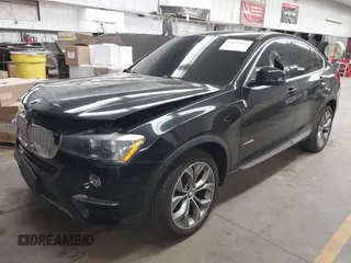 2015 BMW X4 xDrive28i z VIN 5UXXW3C59F0M87082, wystawiony jako IAAI lot #41839047 z przebiegiem 142 081 mil mil oraz . Historia ofert i sprzedaży dostępna na DreamBid. Obrazek 2.
