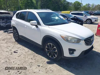 2016 Mazda CX-5 Grand Touring z VIN JM3KE4DY7G0701671, wystawiony jako IAAI lot #42022900 z przebiegiem 197 544 mil mil oraz . Historia ofert i sprzedaży dostępna na DreamBid. Obrazek 1.