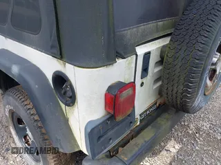 1998 Jeep Wrangler SE with VIN 1J4FY29P0WP792787, listed as a IAAI auction lot 42631661 with 190,180 mi miles and . Bid and sale history available at DreamBid. Image 15.