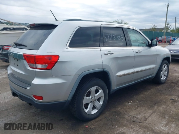 2011 Jeep Grand Cherokee Laredo with VIN 1J4RR4GG0BC622732, listed as a IAAI auction lot 42218785 with 127,186 mi miles and . Bid and sale history available at DreamBid. Image 4.