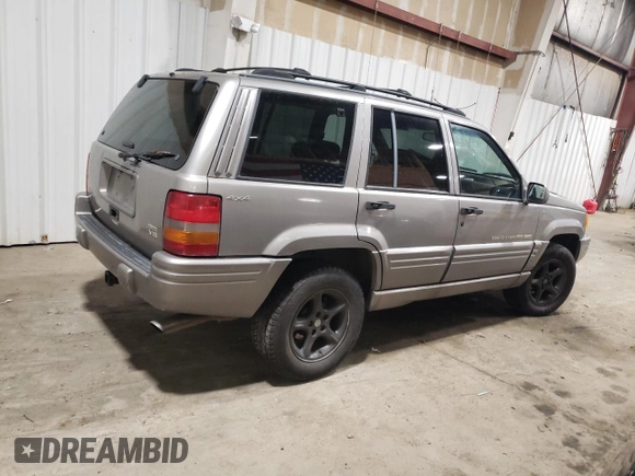 1998 Jeep Grand Cherokee Limited with VIN 1J4GZ88Z1WC289820, listed as a Copart auction lot 88583995 with 245,572 mi miles and Clean Title. Bid and sale history available at carsss.com. Image 3.