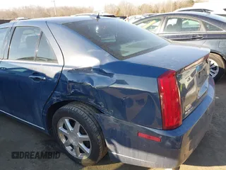 2009 Cadillac STS AWD w/1SB with VIN 1G6DD67VX90130281, listed as a IAAI auction lot 41384191 with 102,943 mi miles. Bid and sale history available at carsss.com. Image 6.
