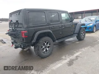 2021 Jeep Wrangler Unlimited Rubicon with VIN 1C4HJXFG8MW775419, listed as a IAAI auction lot 41797178 with 56,166 mi miles. Bid and sale history available at carsss.com. Image 4.