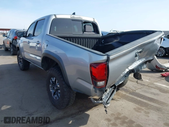 2018 Toyota Tacoma SR5 with VIN 3TMAZ5CN0JM053861, listed as a IAAI auction lot 41920377 with 104,015 mi miles and . Bid and sale history available at DreamBid. Image 3.