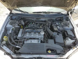 2002 Mazda Protege DX z VIN JM1BJ225920543960, wystawiony jako Copart lot #56336555 z przebiegiem 173 874 mil mil oraz Szkoda całkowita • Salvage title. Historia ofert i sprzedaży dostępna na DreamBid. Obrazek 11.