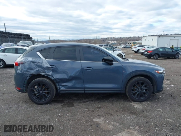 2021 Mazda CX-5 Touring with VIN JM3KFBCM5M0483547, listed as a IAAI auction lot 41683694 with 55,791 mi miles. Bid and sale history available at carsss.com. Image 13.