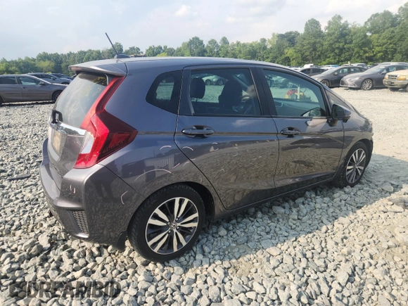 2015 Honda Fit EX-L with VIN 3HGGK5H87FM708737, listed as a Copart auction lot 64310745 with 90,446 mi miles and Salvage title. Bid and sale history available at DreamBid. Image 3.