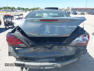 2005 Pontiac Grand Am SE with VIN 1G2NE52E25M101462, listed as a IAAI auction lot 41743136 with 77,376 mi miles. Bid and sale history available at carsss.com. Image 6.