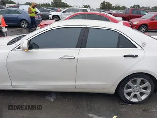 2013 Cadillac ATS Luxury z VIN 1G6AB5RA1D0156368, wystawiony jako IAAI lot #41283194 z przebiegiem 95 770 mil mil oraz . Historia ofert i sprzedaży dostępna na DreamBid. Obrazek 14.