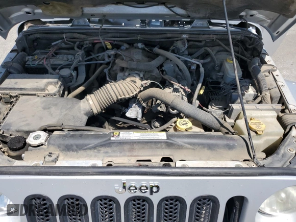 2007 Jeep Wrangler Unlimited Sahara with VIN 1J8GA59137L181360, listed as a Copart auction lot 62311225 with 151,393 mi miles and Salvage title. Bid and sale history available at DreamBid. Image 11.