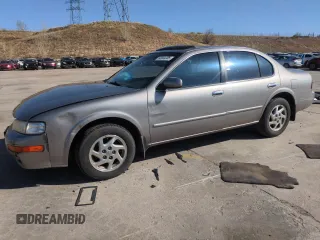 1999 Nissan Maxima GXE z VIN JN1CA21A9XT707073, wystawiony jako Copart lot #56646505 z przebiegiem 149 873 mil mil oraz Nie do naprawy • Non repairable. Historia ofert i sprzedaży dostępna na DreamBid. Obrazek 1.