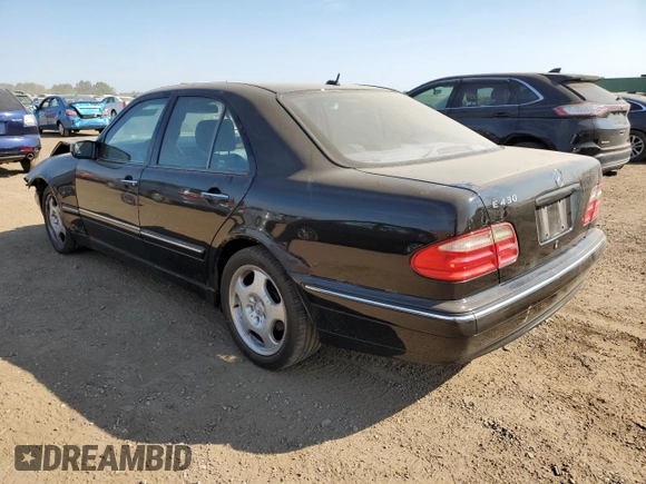 2002 Mercedes-Benz E-Class with VIN WDBJF70J22B489706, listed as a Copart auction lot 71109874 with 59,167 mi miles and Salvage Title. Bid and sale history available at carsss.com. Image 2.